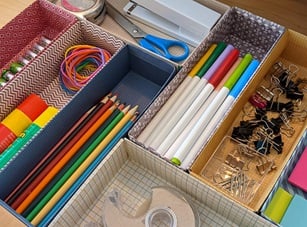 A DIY desk organizer made of recycled Kleenex tissue boxes